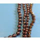Collana multicascata con perle marroni bronzo e cristalli eleganti